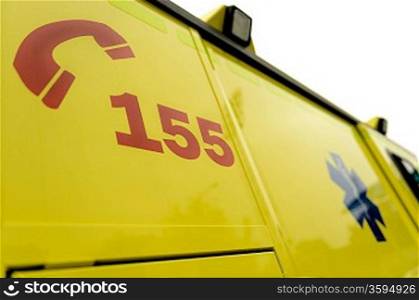 Emergency phone number and paramedic sign on ambulance car