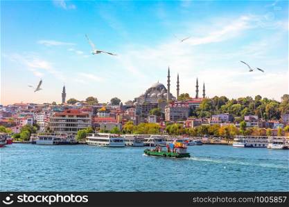 Eminonu Pier and Suleymaniye Mosque in Istanbul, Turkey.. Eminonu Pier and Suleymaniye Mosque in Istanbul, Turkey