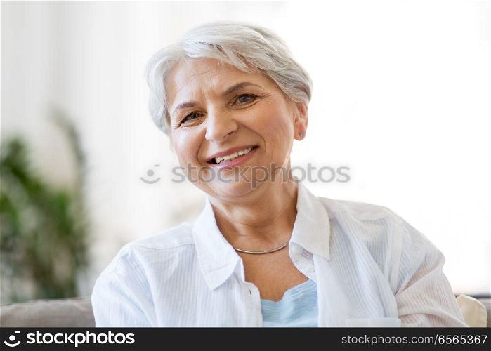 emotion, age and people concept - portrait of happy senior woman laughing. portrait of happy senior woman laughing