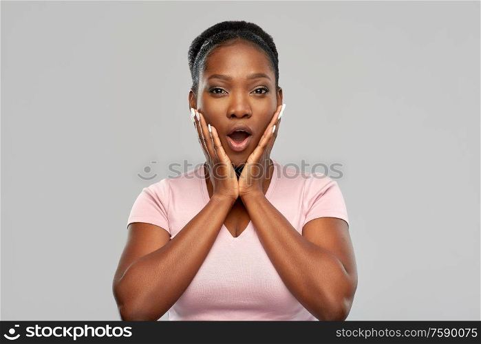 emotion, expression and people concept - shocked african american woman with open mouth over grey background. shocked african american woman with open mouth