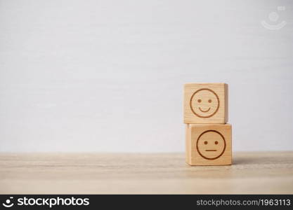 emotion face symbol on wooden blocks. mood, Service rating, ranking, customer review, satisfaction, evaluation and feedback concept