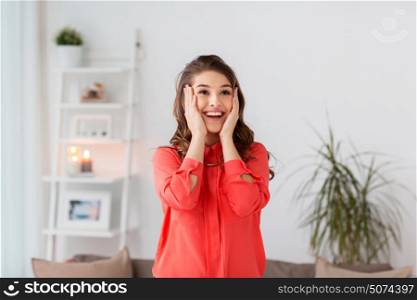 emotion, facial expression people concept - happy young woman at home. happy young woman at home