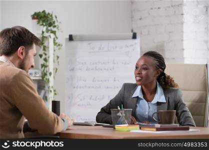 Emotional businesswoman gesturing during meeting at office