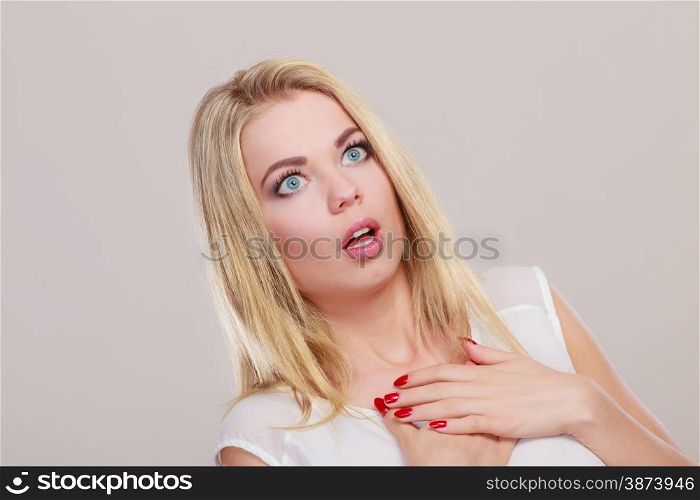 Emotional facial expression wide eyed woman surprised girl open mouth .