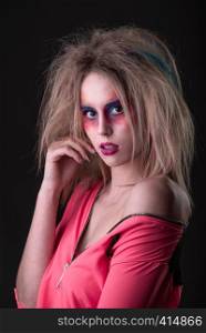 Emotional Portrait of a Attractive young girl with carnival colorful makeup and disheveled hair. Attractive young girl with disheveled hair