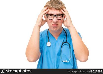 emotional portrait of a crazy doctor with a headache on a white background