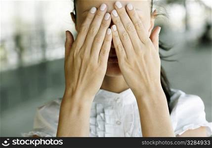 emotional stress ,woman with hands covering the eyes, selective focus