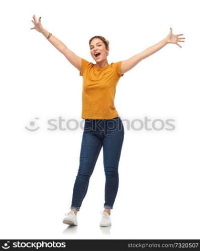 emotions and people concept - happy young woman or teenage girl in blank orange t-shirt having fun over white background. happy young woman or teenage girl having fun
