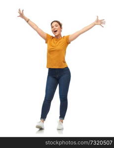 emotions and people concept - happy young woman or teenage girl in blank orange t-shirt having fun over white background. happy young woman or teenage girl having fun