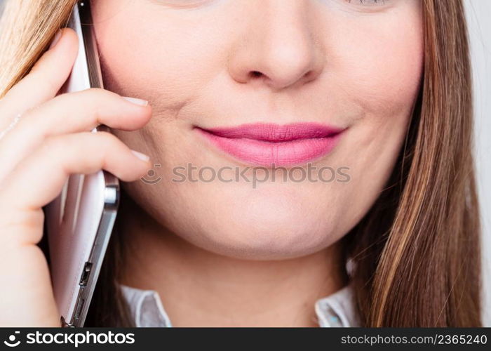 Emotions communication and message technology. Young happy woman talk make a phone call smiling.. Smiling young woman use phone.