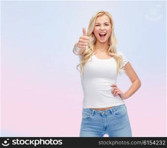 emotions, expressions, advertisement and people concept - happy smiling young woman or teenage girl in white t-shirt showing thumbs up over rose quartz and serenity gradient background