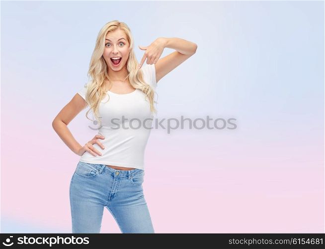 emotions, expressions, advertisement and people concept - happy smiling young woman or teenage girl in white t-shirt pointing finger to herself over rose quartz and serenity gradient background