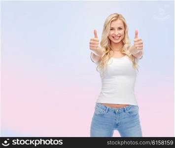 emotions, expressions, advertisement and people concept - happy smiling young woman or teenage girl in white t-shirt showing thumbs up with both hands over rose quartz and serenity gradient background