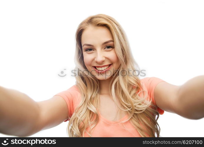 emotions, expressions and people concept - happy smiling young woman taking selfie