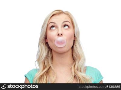 emotions, expressions and people concept - happy young woman or teenage girl chewing gum