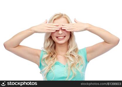 emotions, expressions and people concept - smiling young woman or teenage girl covering her eyes with palms