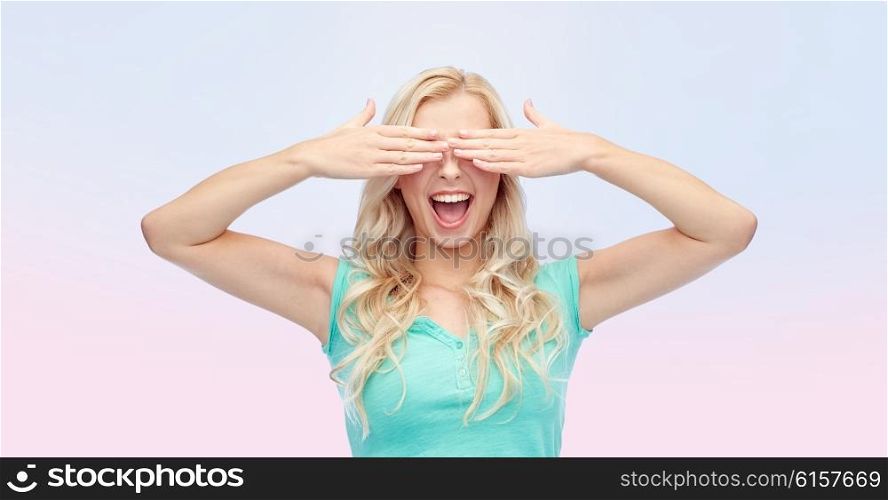 emotions, expressions and people concept - smiling young woman or teenage girl covering her eyes with palms over rose quartz and serenity gradient background