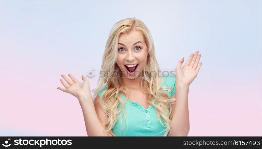 emotions, expressions and people concept - surprised smiling young woman or teenage girl over rose quartz and serenity gradient background