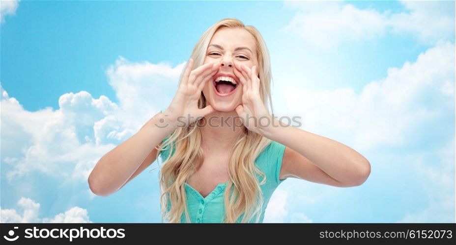 emotions, expressions and people concept - young woman or teenage girl shouting over blue sky and clouds background