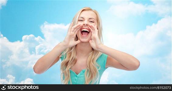 emotions, expressions and people concept - young woman or teenage girl shouting over blue sky and clouds background