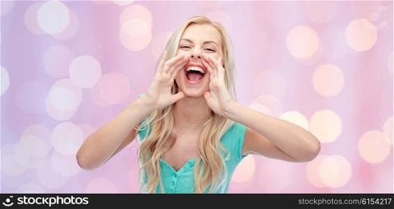 emotions, expressions and people concept - young woman or teenage girl shouting over pink holidays lights background