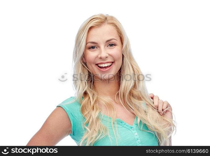 emotions, expressions, hairstyle and people concept - smiling young woman or teenage girl holding her strand of hair