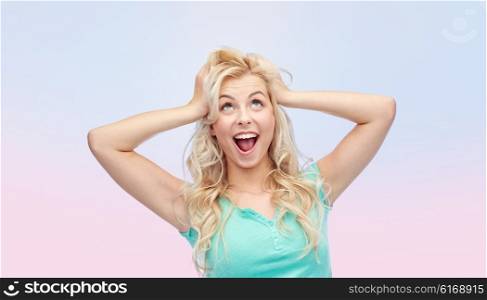 emotions, expressions, hairstyle and people concept - smiling young woman or teenage girl holding to her head or touching hair over rose quartz and serenity gradient background