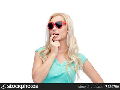 emotions, expressions, summer and people concept - smiling young woman or teenage girl in sunglasses