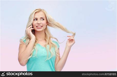 emotions, expressions, technology and people concept - smiling young woman or teenage girl calling on smartphone over pink background