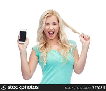 emotions, expressions, technology and people concept - smiling young woman or teenage girl showing blank smartphone screen and winking