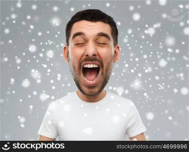 emotions, stress, winter, christmas and people concept - crazy shouting man in white t-shirt over snow on gray background (funny cartoon style character with big head)