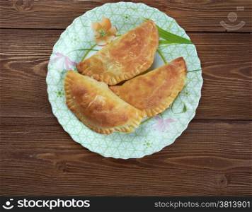 Empanada - Argentine fried meat pate.stuffed bread or pastry baked or fried in many countries in Latin Europe, Latin America, the Southwestern United States, and parts of Southeast Asia