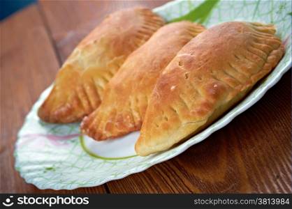 Empanada - Argentine fried meat pate.stuffed bread or pastry baked or fried in many countries in Latin Europe, Latin America, the Southwestern United States, and parts of Southeast Asia