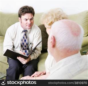 Empathetic couples counselor helping a senior couple with their marriage.
