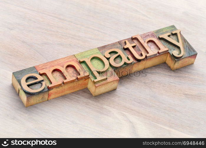 empathy word abstract in letterpress wood type blocks stained by color inks