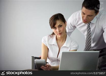 employee at her desk with colleague