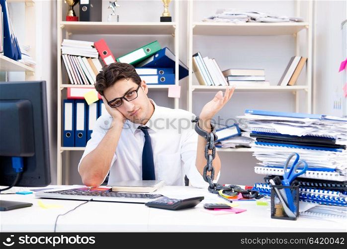 Employee attached and chained to his desk with chain