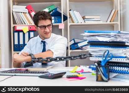 Employee attached and chained to his desk with chain