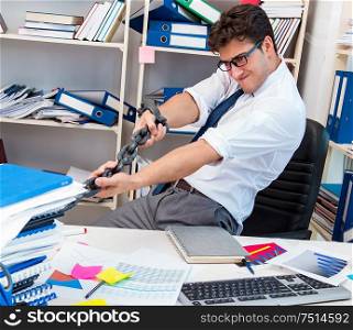 Employee attached and chained to his desk with chain. The employee attached and chained to his desk with chain