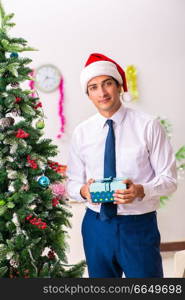 Employee businessman celebrating christmas in office