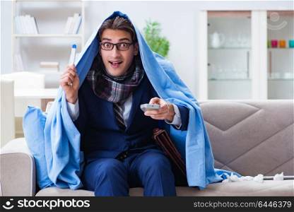 Employee businessman watching tv while being sick with flu