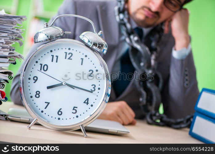 Employee chained to his desk due to workload