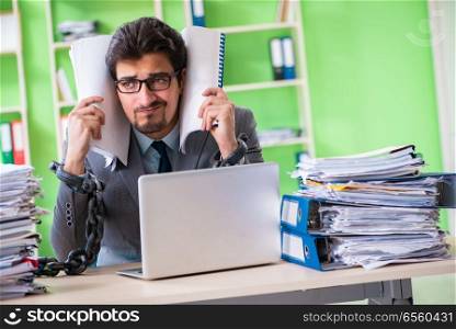 Employee chained to his desk due to workload