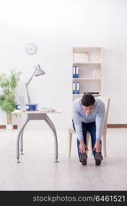 Employee doing stretching exercises in the office