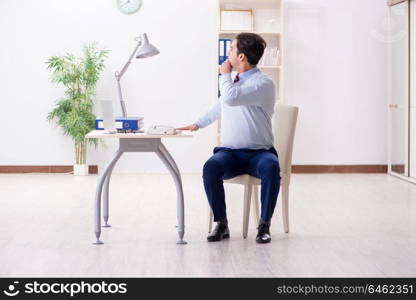 Employee doing stretching exercises in the office