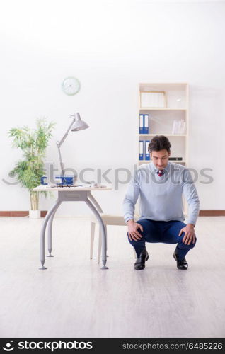 Employee doing stretching exercises in the office