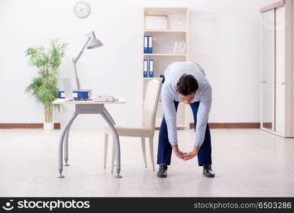 Employee doing stretching exercises in the office