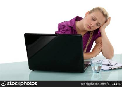 Employee falling asleep at her desk
