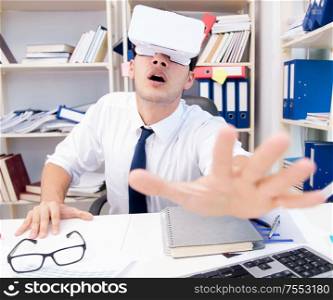 Employee watching movie on vr virtual reality glasses. The employee watching movie on vr virtual reality glasses