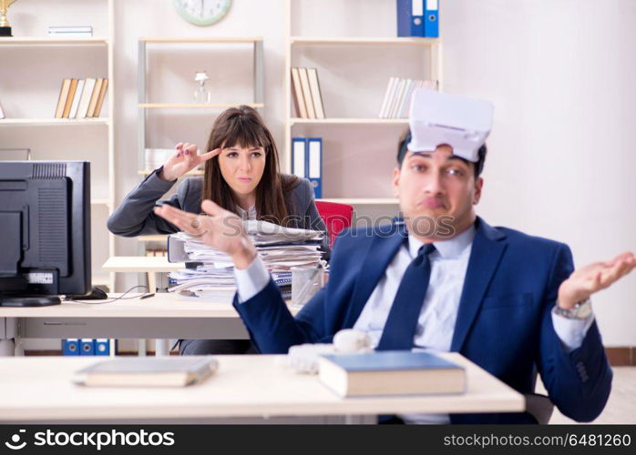 Employee with virtual reality glasses in office